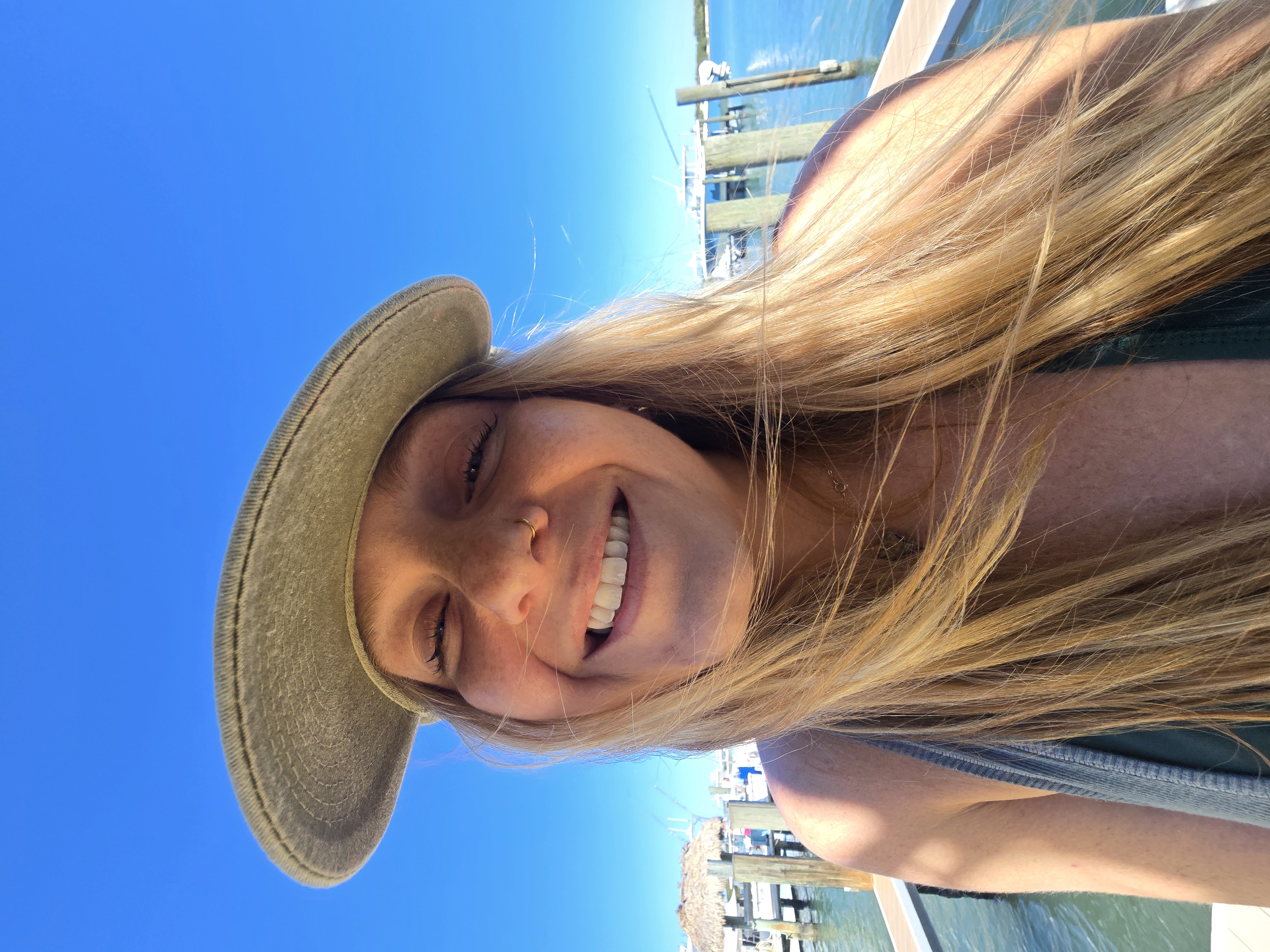 Danielle smiling by the water